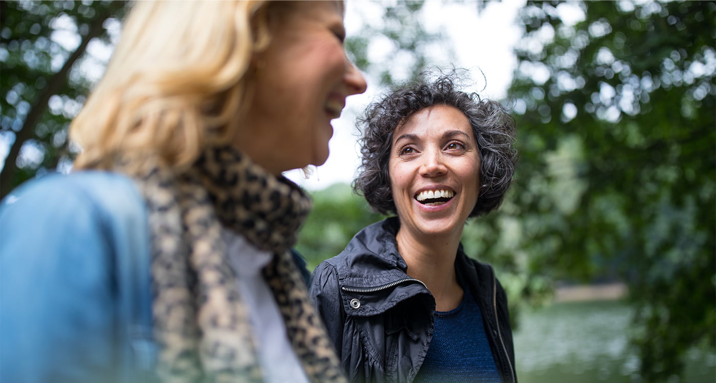 a woman laughing with her friend